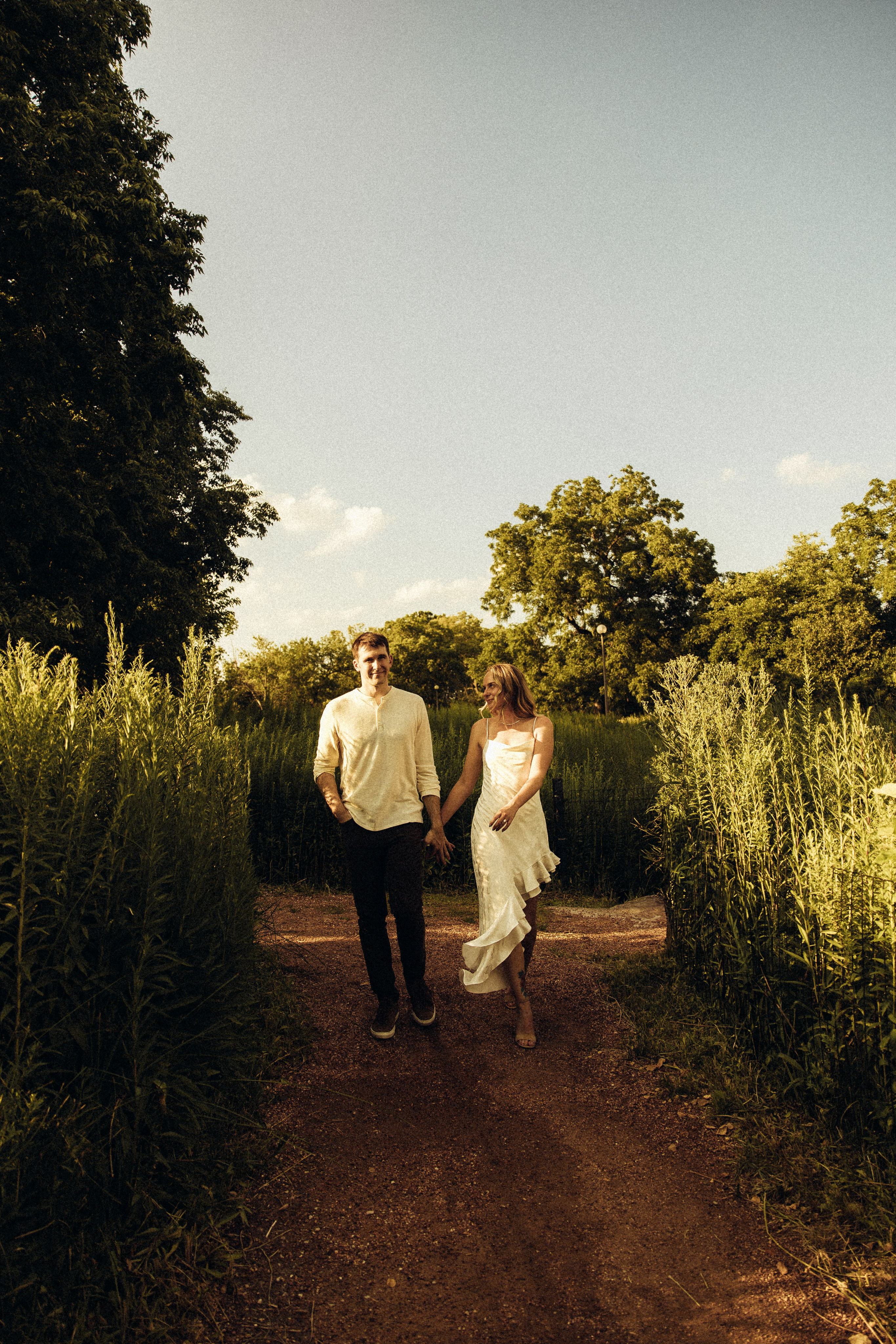 Delicate flowers taped to a wall.