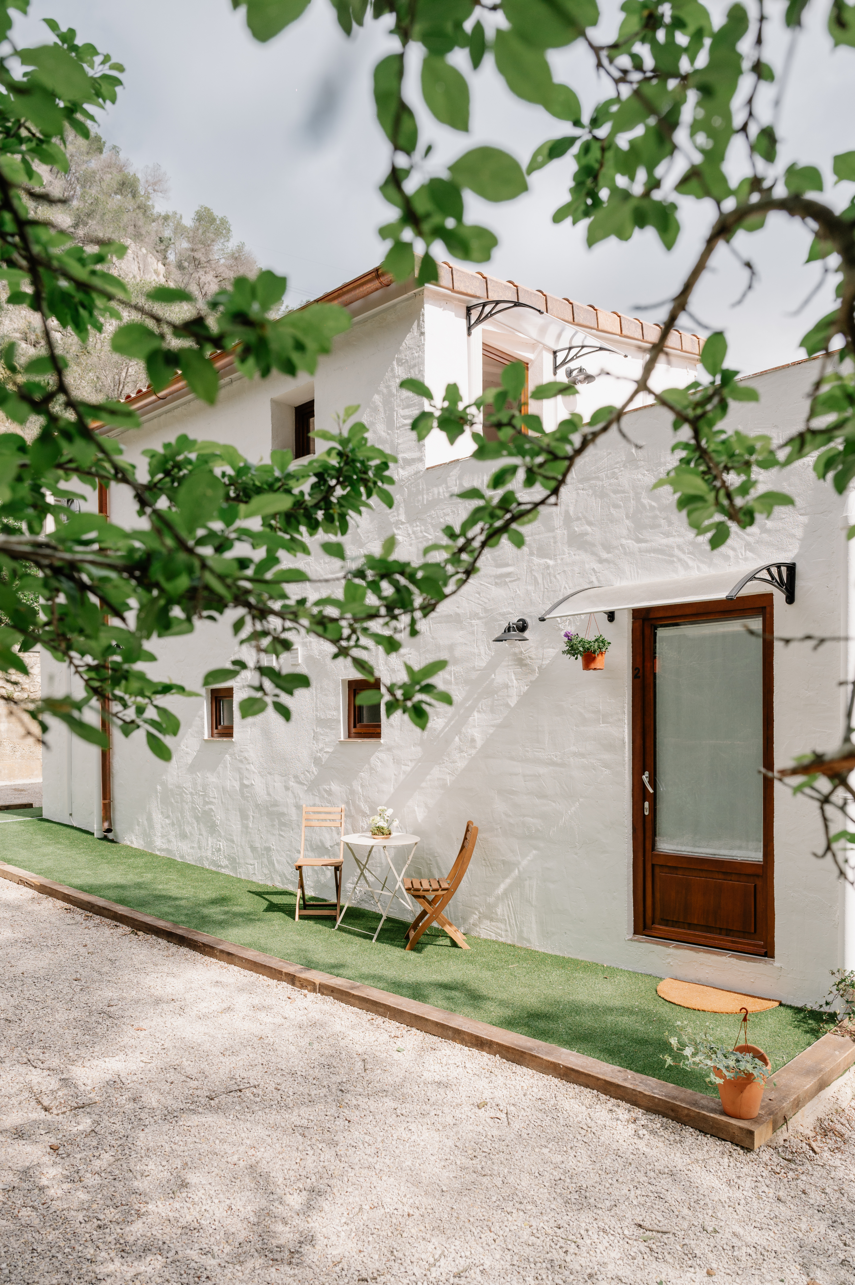 Wide landscape shot at sunset of rolling green hills.