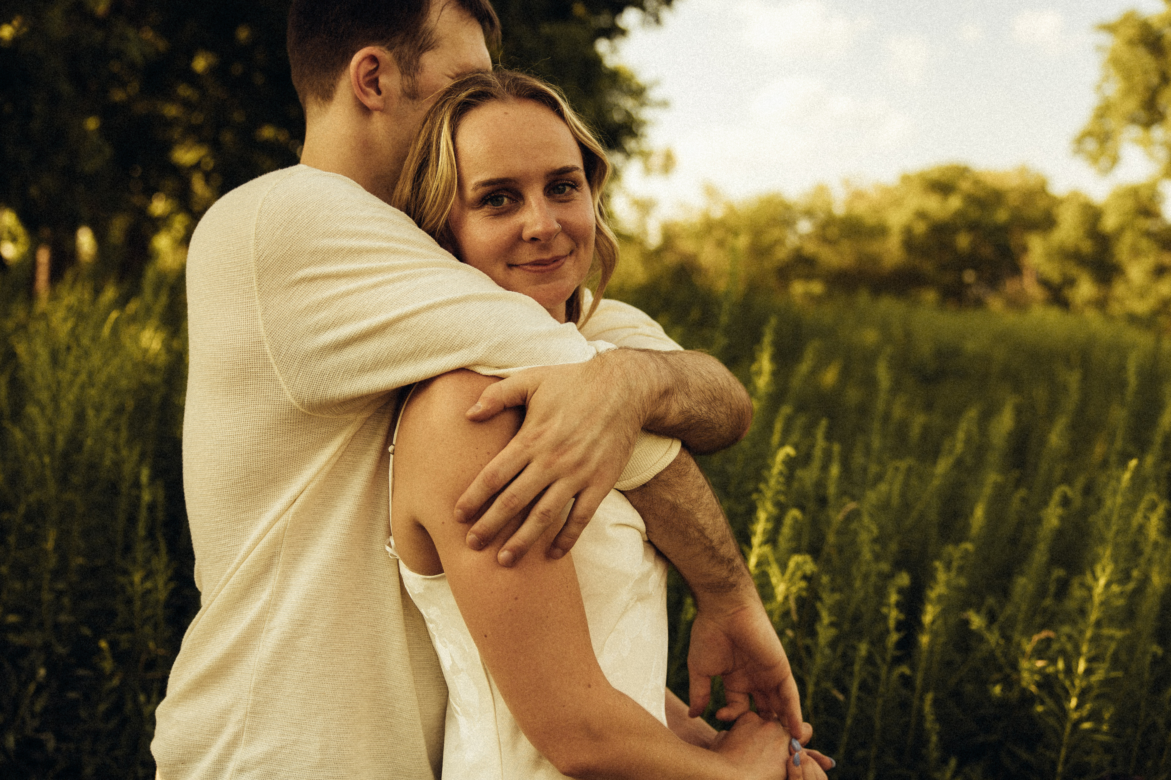 Delicate flowers taped to a wall.